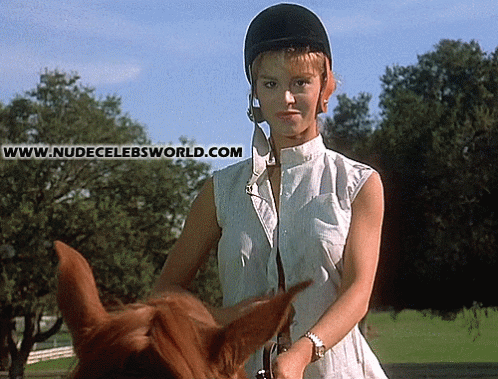 Busty b-movie star Betsy Russell flashes her big boobs on horse gif