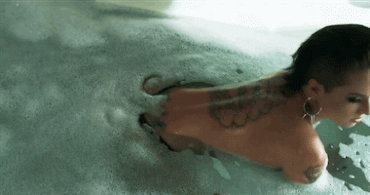 Sex Gif - Christy Mack gets out of the water in a bathing suit with her big plump ass