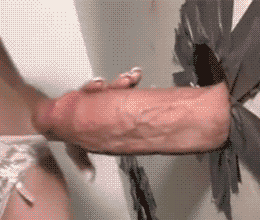 Sex Gif - Monster cock being stroked through a glory hole
