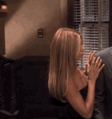 Sex Gif - Jennifer Aniston adjusting her Top