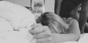 Sex Gif - Sitting on her - fucking her from behind, while she buries her face in the pillow.